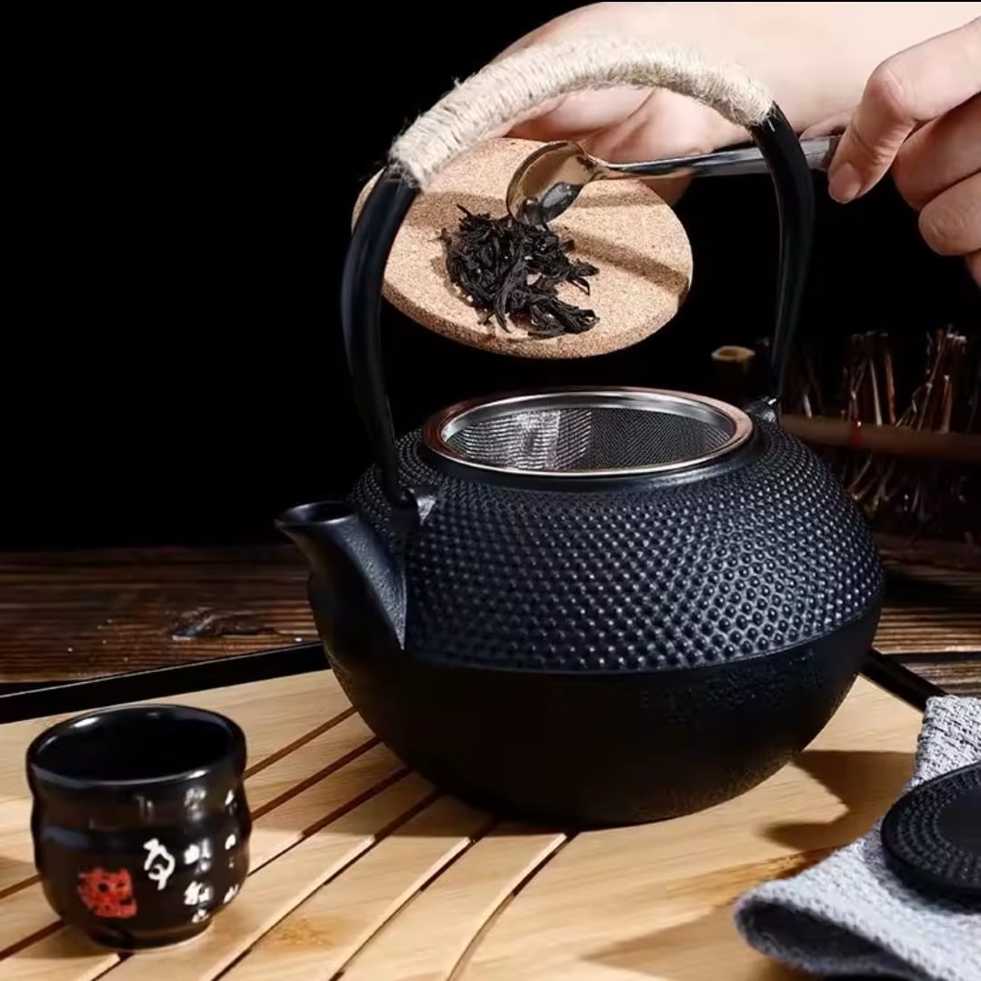 Original heavy duty cast iron tea pot with infuser, cast iron coaster and spoon