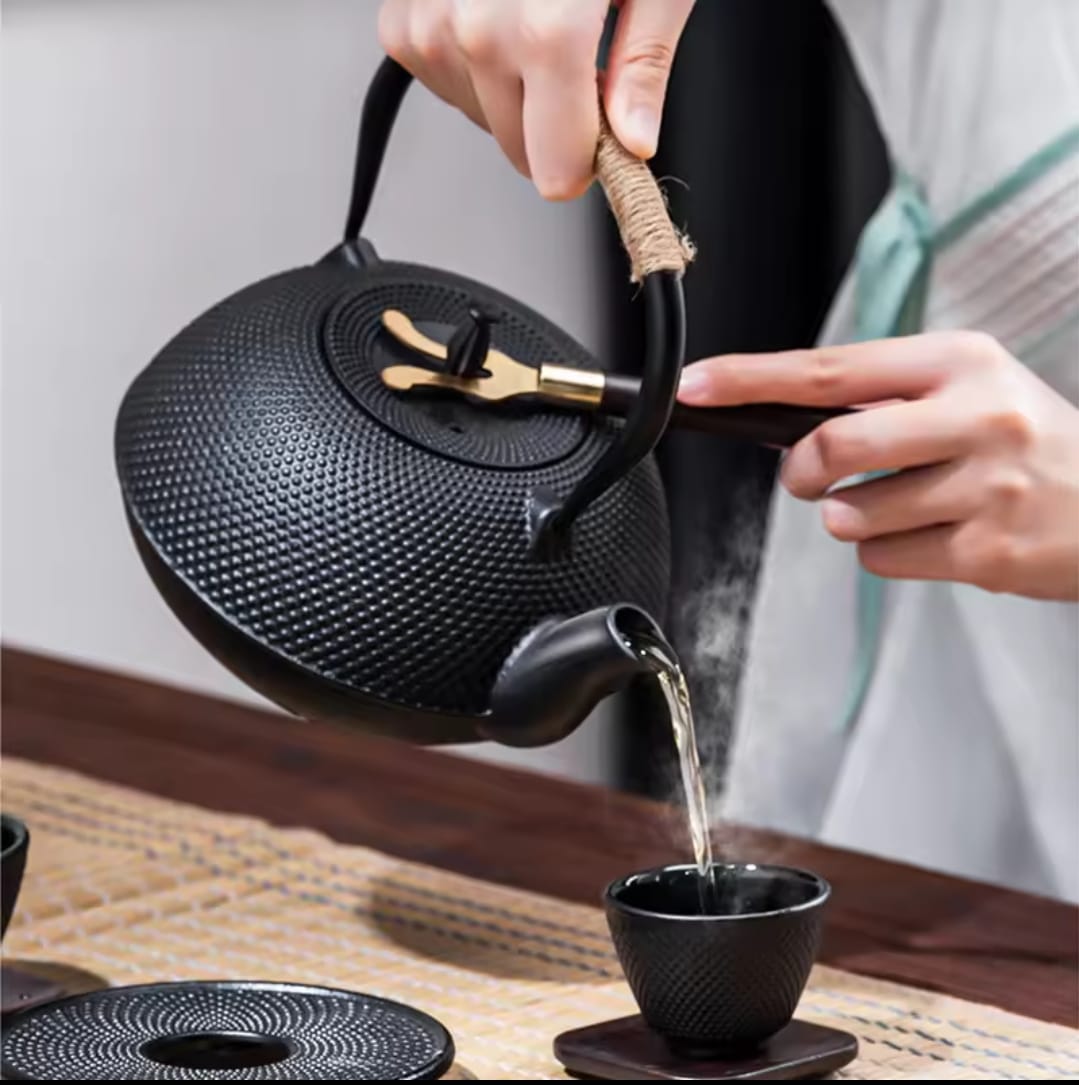 Original heavy duty cast iron tea pot with infuser, cast iron coaster and spoon