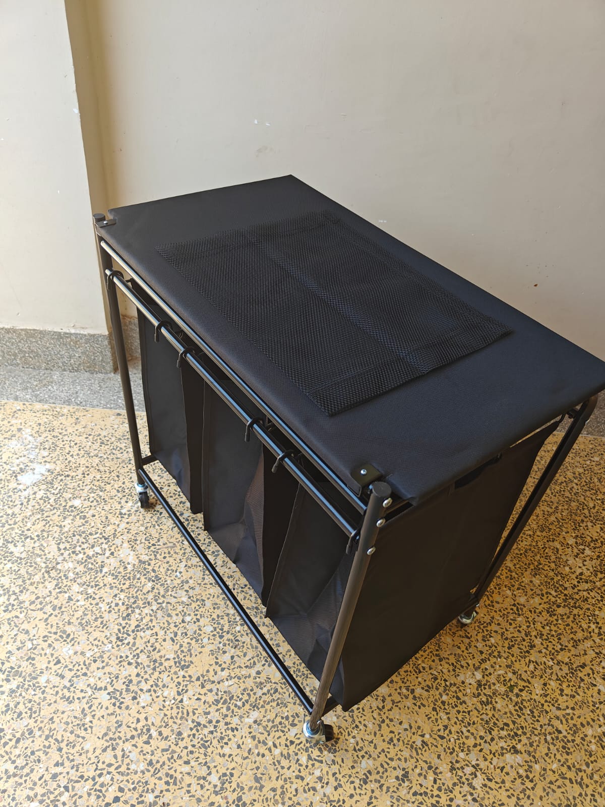 3 Compartment laundry basket with lockable wheels and ironing board