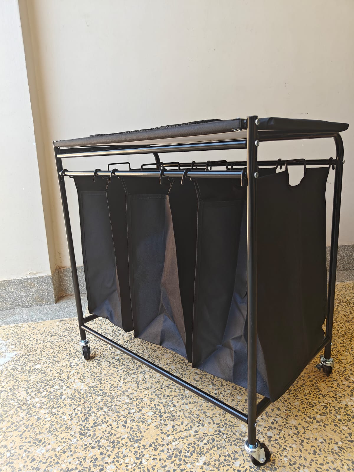 3 Compartment laundry basket with lockable wheels and ironing board