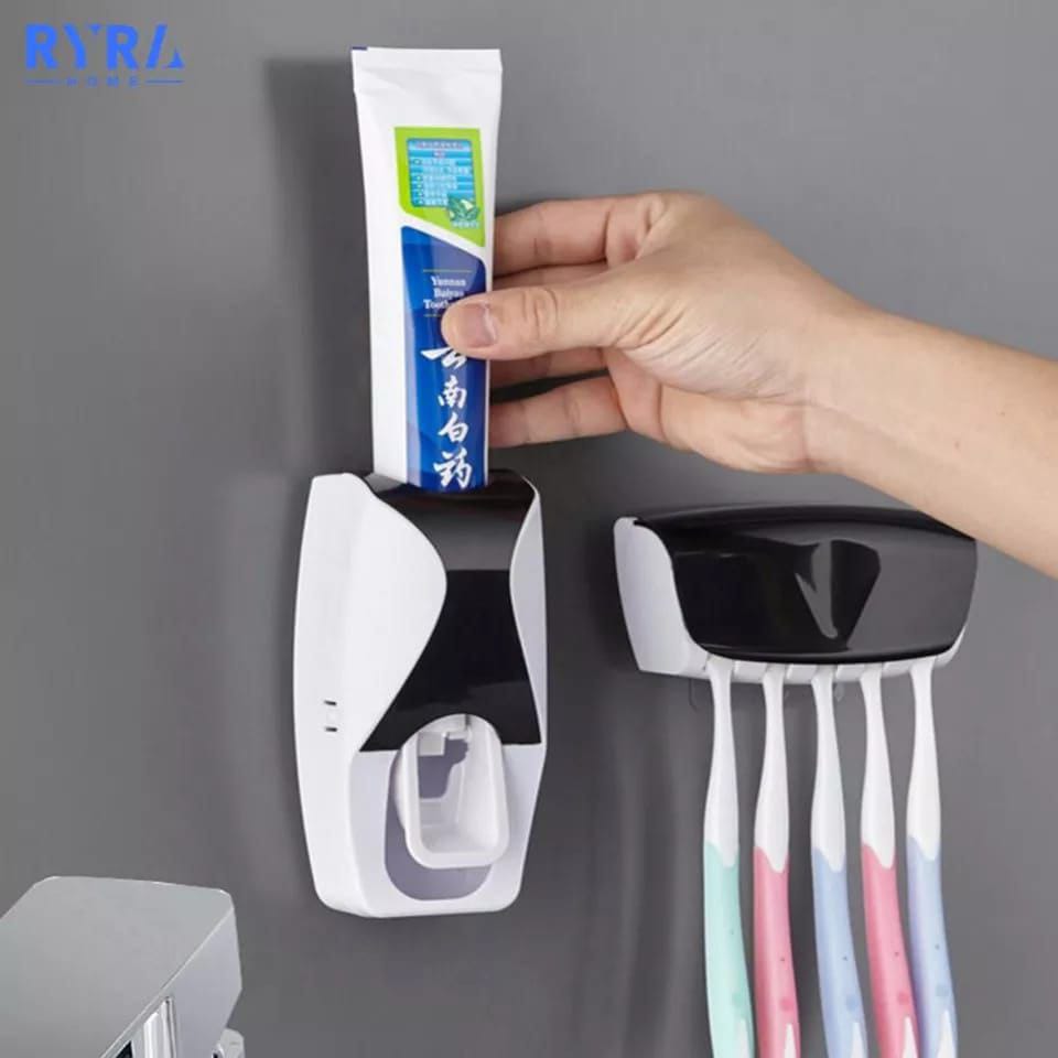 Toothpaste dispenser with toothbrush holder