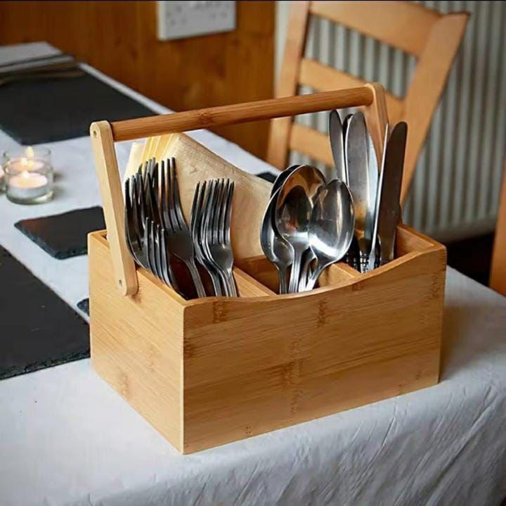 Portable countertop/kitchen cutlery organizer with handle.
