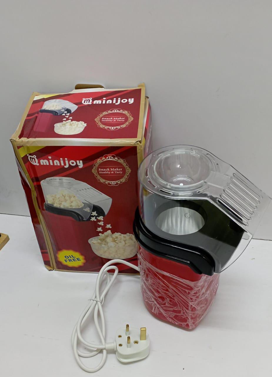 Portable hot air popcorn maker with measuring cup