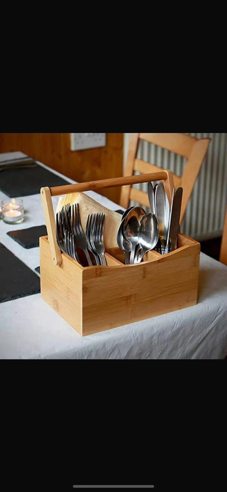 Portable countertop/kitchen cutlery organizer with handle.