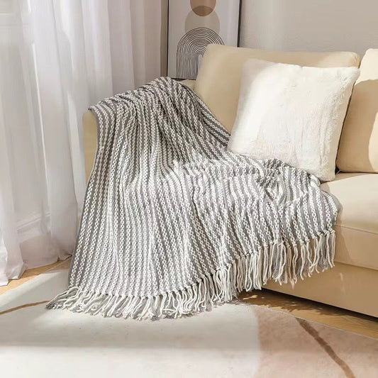 Textured knitted heavy throw blanket with tassels