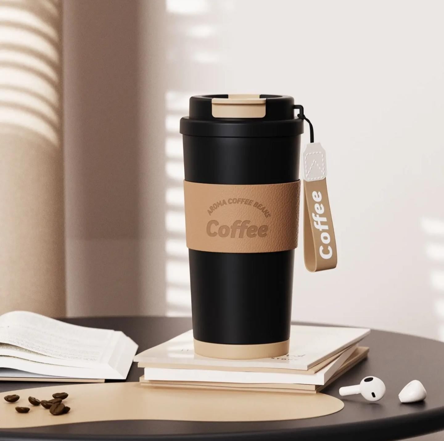 vacuum insulated 304 stainless steel Coffee mug with a leather sleeve and a straw.