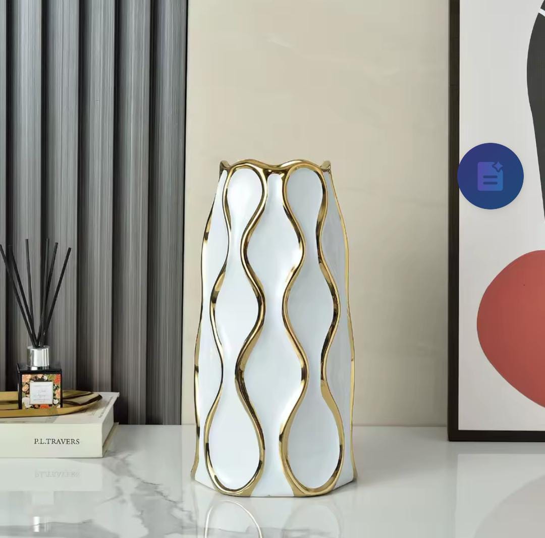 Black and white ceramic vase with golden trim.Very ideal for setting up center pieces